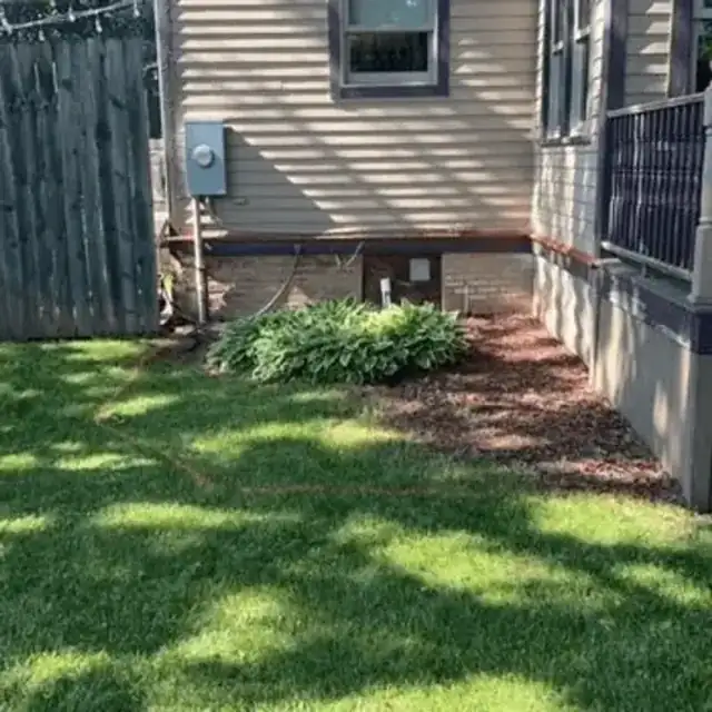 Backyard before paver patio installation