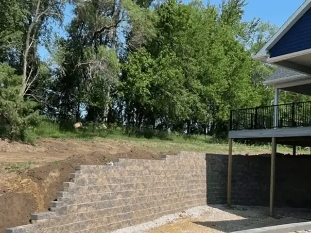 Completed retaining wall with finished landscaping