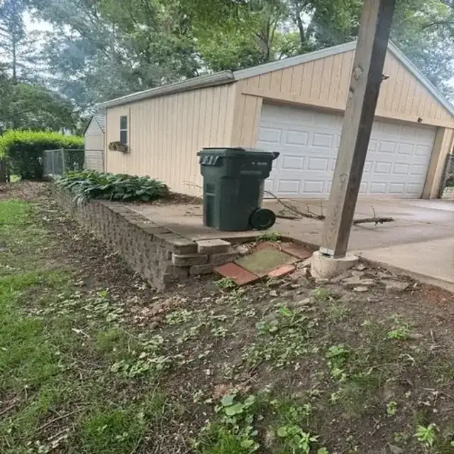 Sloped property before retaining wall build